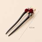 15.5cm camellia ebony wood hair fork placed at a 45-degree angle with size marked in centimeters for long thick hair