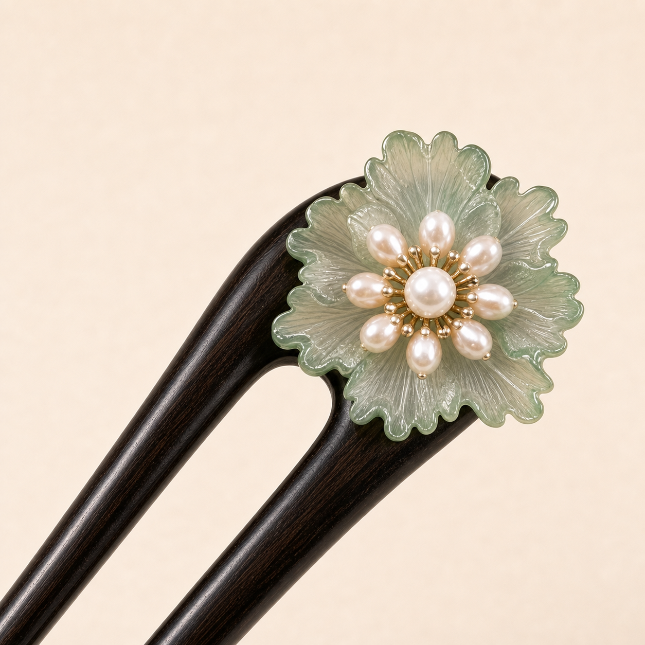 Close-up of green glaze flower ebony wood hair fork with smooth hand-polished finish and floral accent for thick hair updos