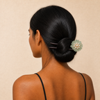 Model wearing green glaze flower ebony wood hair fork in a low bun, creating a secure updo for long thick hair and curly hair