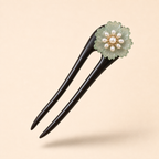Green glaze flower ebony wood hair fork floating at a 45-degree angle with soft shadow, showing long shape for secure buns

