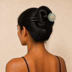 Model wearing green glaze flower ebony hair fork in a high bun, showing strong hold for full hair volume, heavy hair, and everyday long hair styling