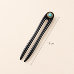 13cm turquoise ebony wood hair fork placed at a 45-degree angle with size marked in centimeters for fine and medium hair
