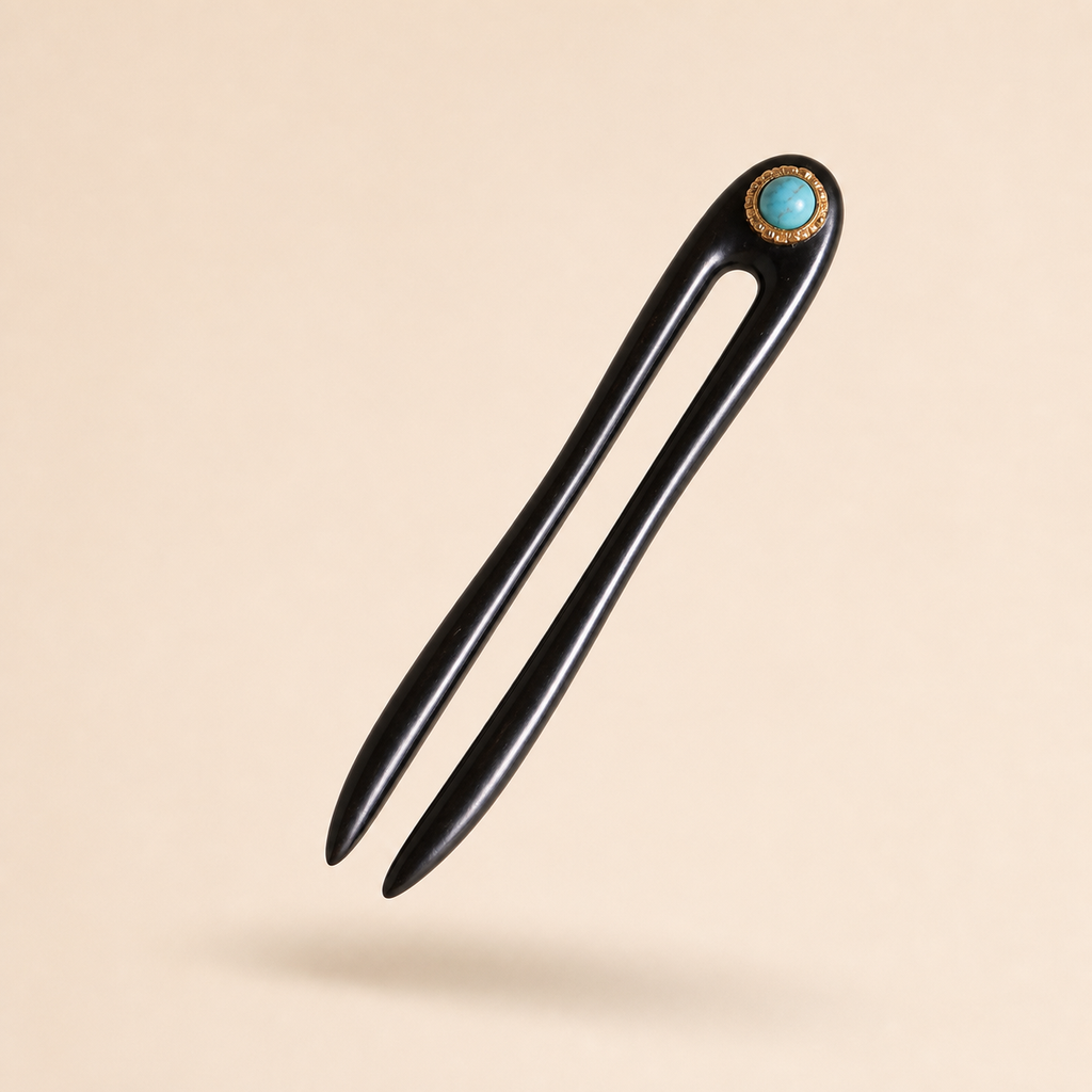 Turquoise ebony wooden hair fork floating at a 45-degree angle with soft shadow, showing slim shape for everyday updos