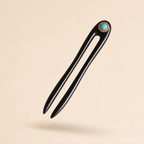 Turquoise ebony wooden hair fork floating at a 45-degree angle with soft shadow, showing slim shape for everyday updos